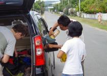 <p>A local gas station. Gasoline is sold by the bottle.</p>